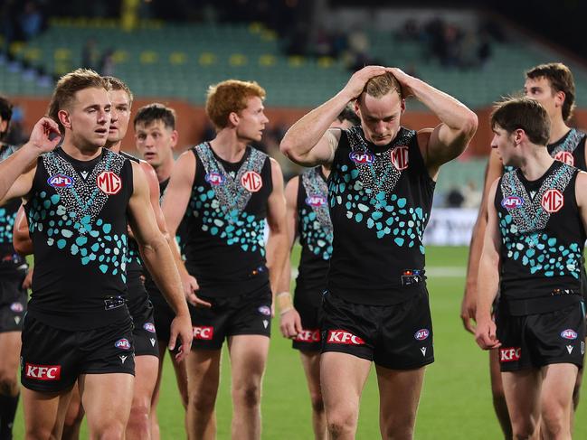 Port Adelaide players after their big loss to Geelong.