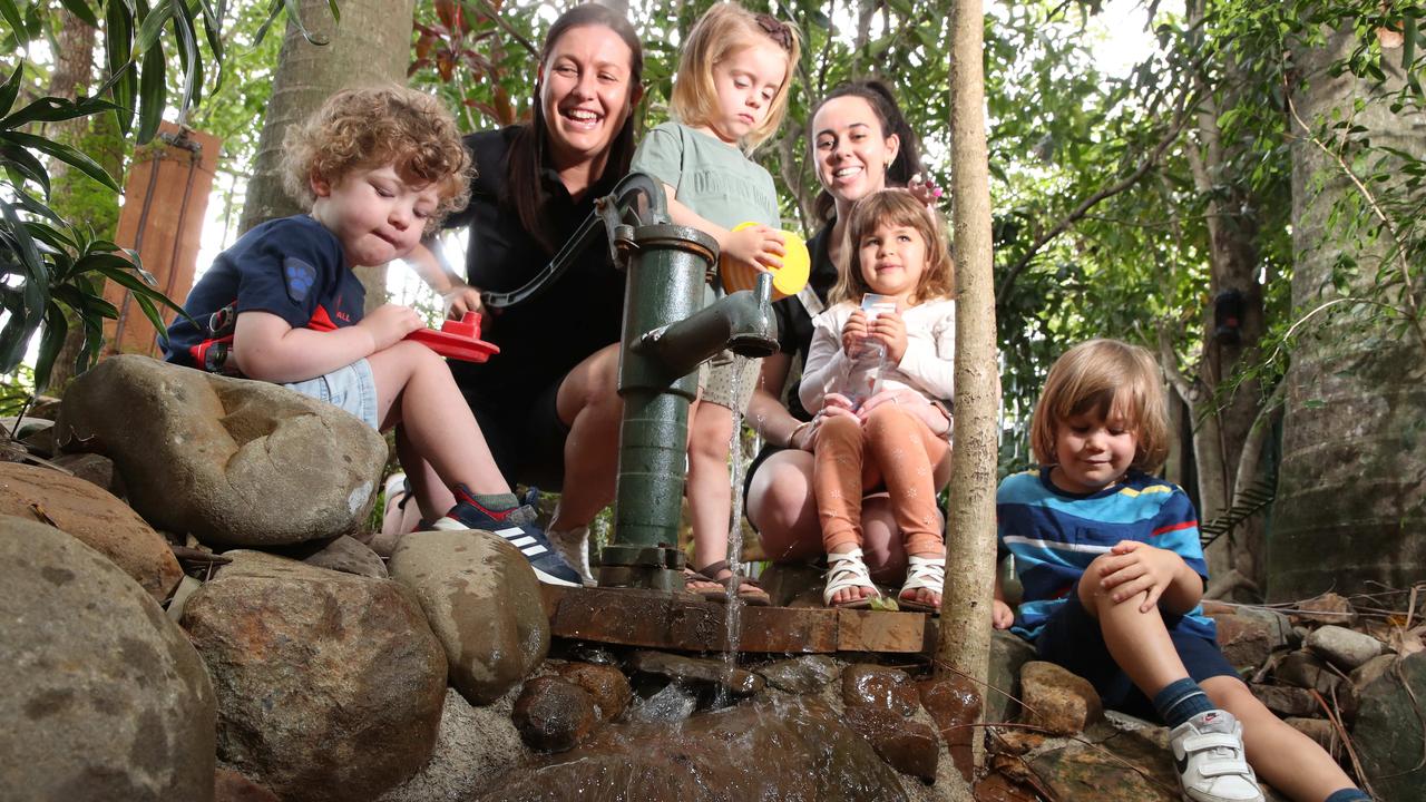 A Head Start Children’s Centre at Currumbin Waters director Renee Haig-Greenwood with staff member Chelsea with children they care for. Picture Glenn Hampson