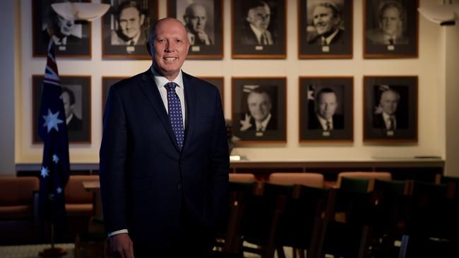 Peter Dutton stands among portraits of former Liberal Party leaders in Parliament House in Canberra on Modnay. Picture: Tracey Nearmy