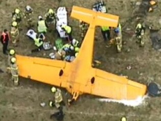 MFB crews respond to an aircraft accident at Moorabbin Airport. On arrival crews found a small training aircraft on its roof. The pilot is currently trapped and crews have established foam hose lines as a precaution while MFB Rescue Operators get to work to free the pilot.Picture: @KateMcG6