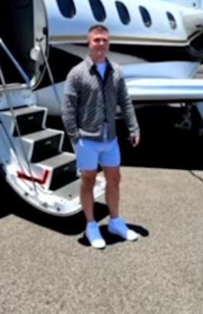 Tyson Scholz poses beside a private jet in an Instagram video about his proposal to his girlfriend.