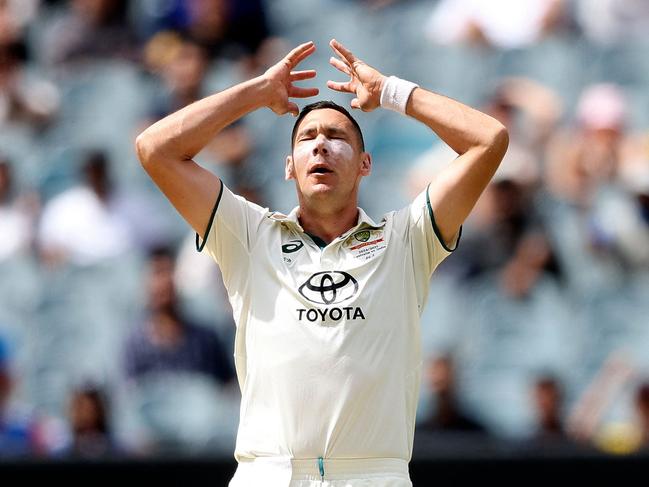 Australia's Scott Boland reacts to a missed catch on on the third day of the fourth cricket Test match between Australia and India at the Melbourne Cricket Ground (MCG) in Melbourne on December 28, 2024. (Photo by Martin KEEP / AFP) / --IMAGE RESTRICTED TO EDITORIAL USE - STRICTLY NO COMMERCIAL USE--