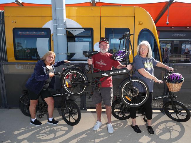 Bike riders Shirley Scott, Keith Bazley and Jan Chatman at Helensvale tram station in 2022. Ms Chatman was advocating for cyclists to be allowed to bring their bikes on trams. Picture: Glenn Hampson.