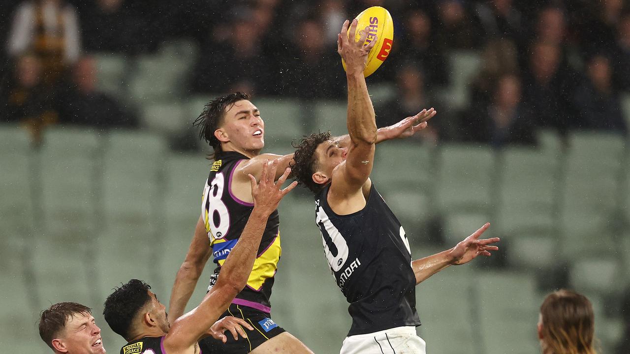 Carlton forward Charlie Curnow takes the ball in front of Richmond defender Josh Gibcus. Photo: Michael Klein