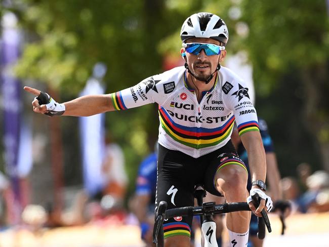 (FILES) In this file photo taken in Huy on July 23, 2022 shows French cyclist Julian Alaphilippe celebrating as he crosses the finish line to win the first stage of the Tour De Wallonie cycling race. - Title holder Alaphilippe will spearhead the French team at the road cycling world championships in Australia, French team manager Thomas Voeckler announced on September 13, 2022. (Photo by JOHN THYS / BELGA / AFP) / Belgium OUT