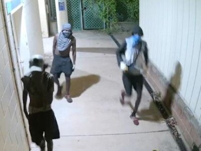 Terrifying CCTV vision captured the prolonged attempts of a gang of up to seven people trying to break into the Katherine Country Club while two workers were trapped inside. Picture: Supplied