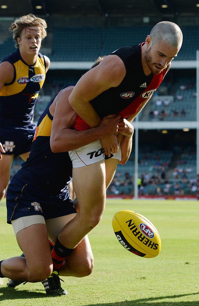 Bomber Nick Kommer dragged down by Elliot Yeo. Picture: Daniel Wilkins