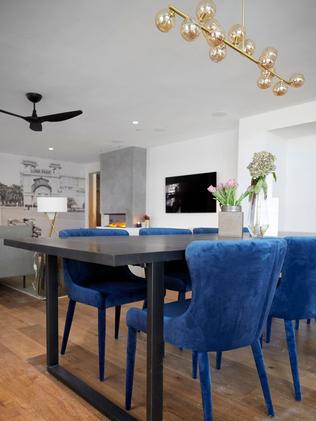 Popping electric blue dining chairs.