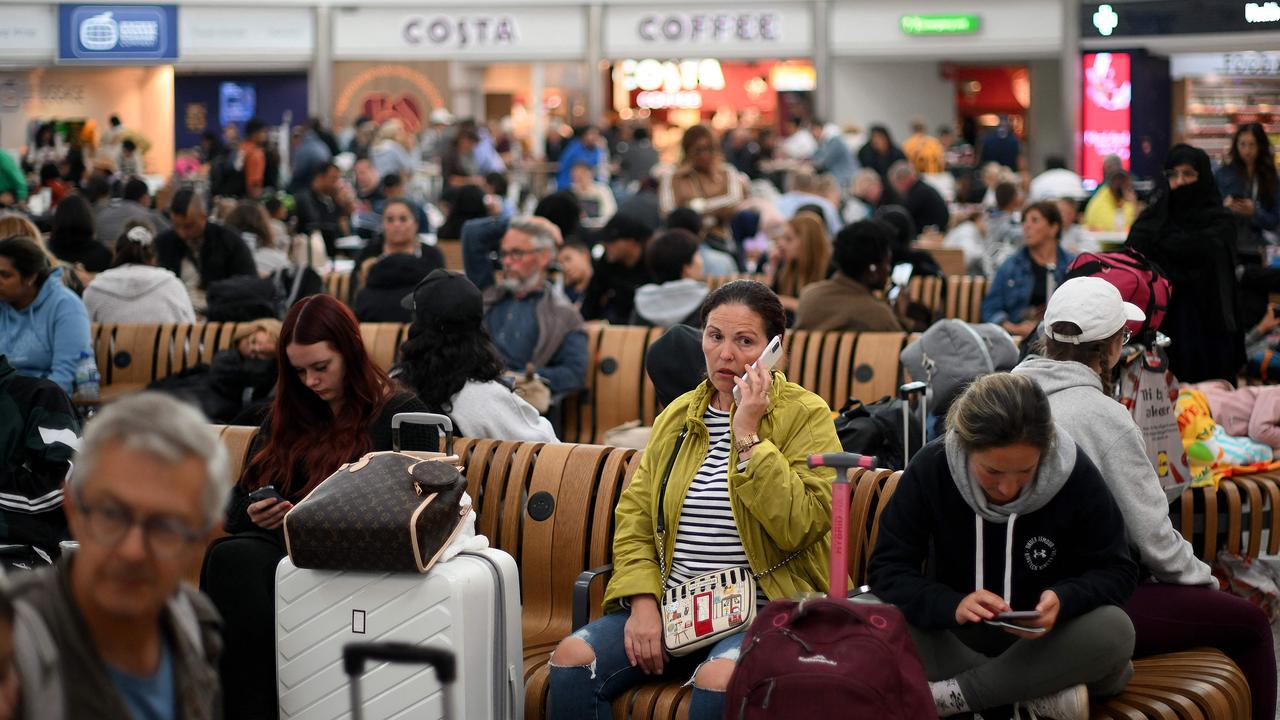 Passengers wait at Stansted Airport, north of London, after UK flights were delayed over a technical issue. Picture: Daniel Leal / AFP