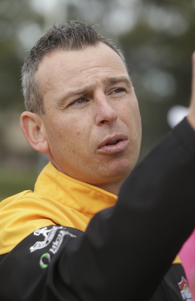 Stingrays coach Craig Black at the quarter-time huddle.