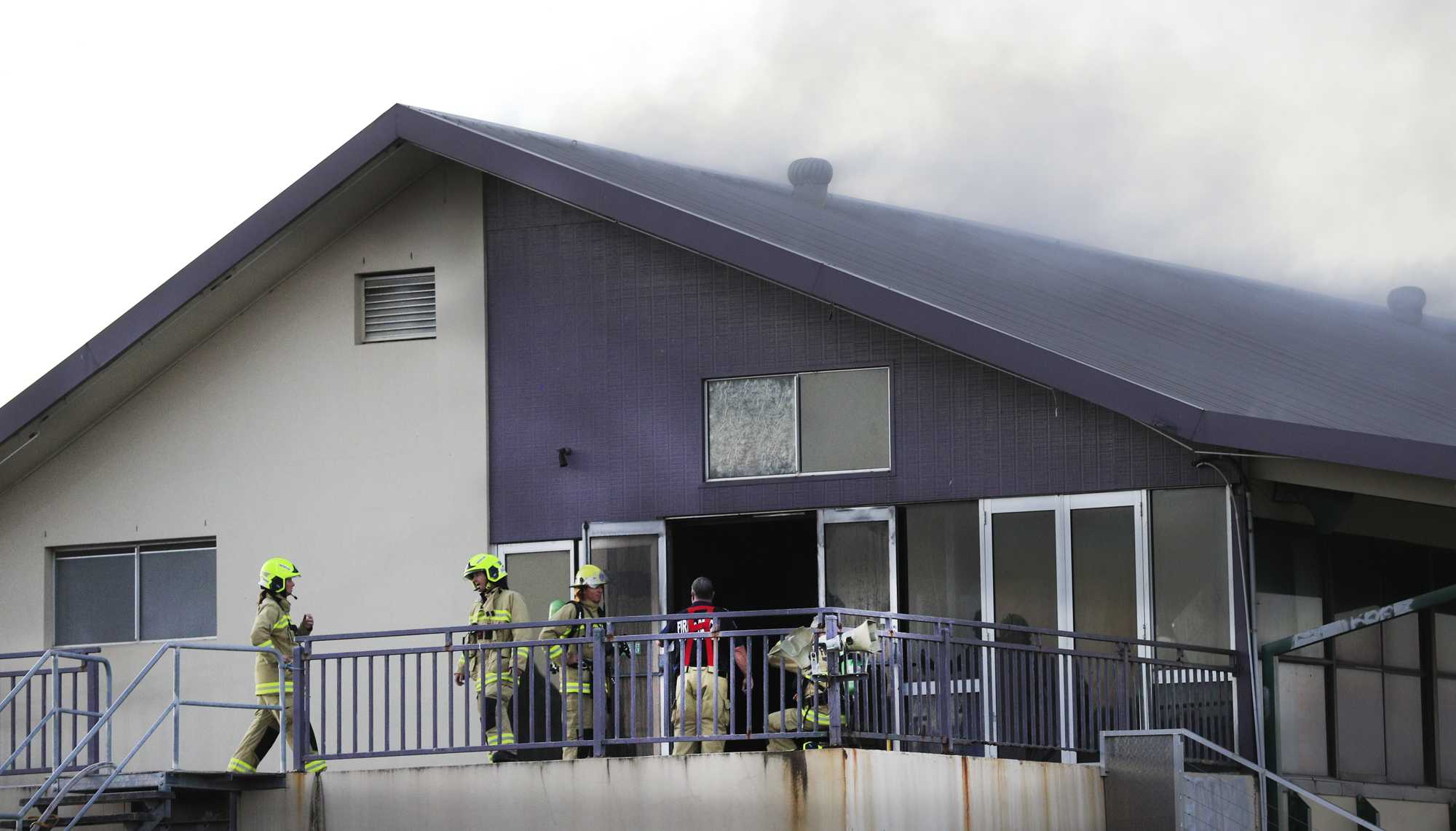 Queensland Fire Brigade Officers assist local Kingscliff and Tweed Fire and Rescue Units to fight the fire .Photo Scott Powick Newscorp