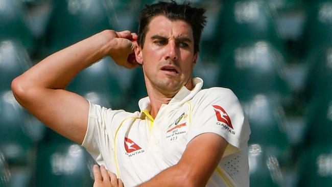 Australia's captain Pat Cummins delivers a ball during the second day of the third cricket Test match between Pakistan and Australia at the Gaddafi Cricket Stadium in Lahore on March 22, 2022. (Photo by Aamir QURESHI / AFP)