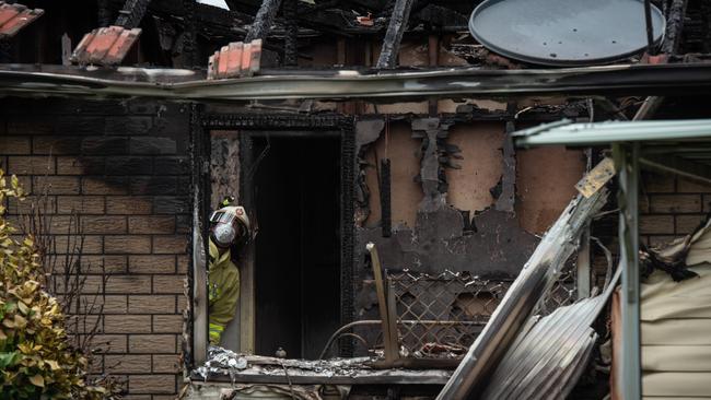 Police and Fire Investigators at the scene of a house fire in Rowe Terrace, Darra where the body of woman was found. PICTURE: Brad Fleet