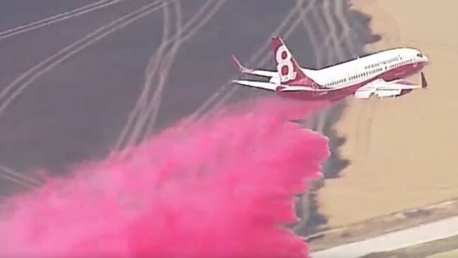 The Boeing air-tanker, in action over Yorketown, can carry 15,150 litres of fire retardant. Picture: 9News