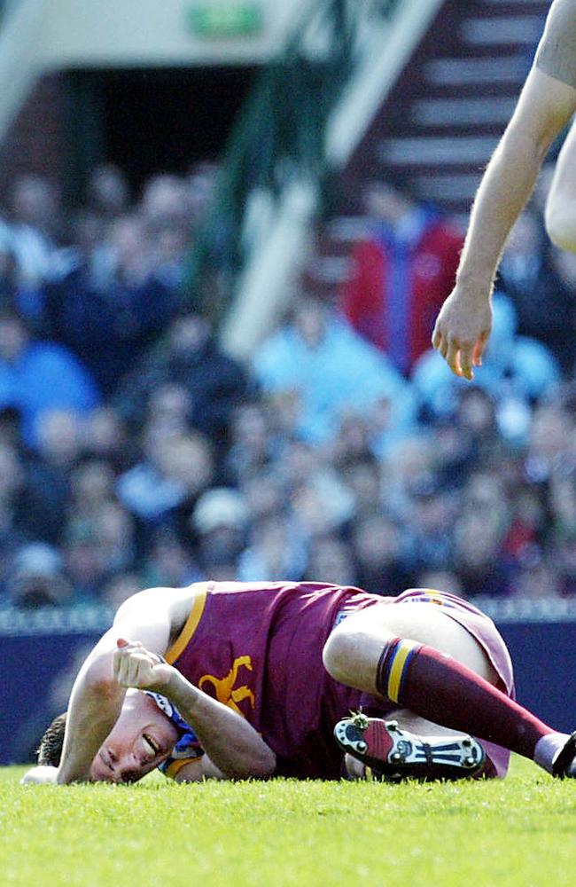 Jonathan Brown after a heavy knock from Scott Burns. Picture: News Corp