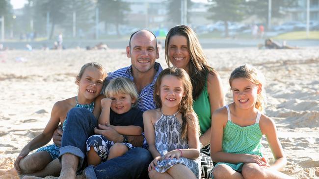 Wallabies assistant coach Nathan Grey pictured with wife Stephanie and their children in 2014.