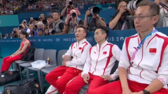 A devastated Su (left) sits apart from his teammates. Picture: BBC