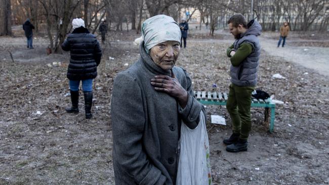 A resident after being rescued from her apartment by firefighters at a residential apartment building after it was hit by a Russian attack in Kyiv. Picture: Getty