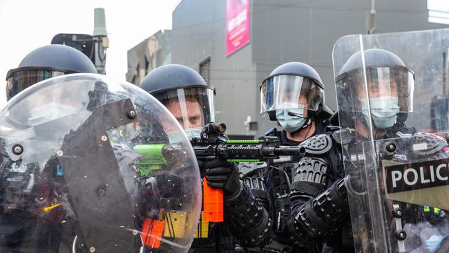 Police fire rubber bullets and tear gas into the crowd of Freedom Rally protesters in Melbourne. Picture: NCA NewsWire/Sarah Matray