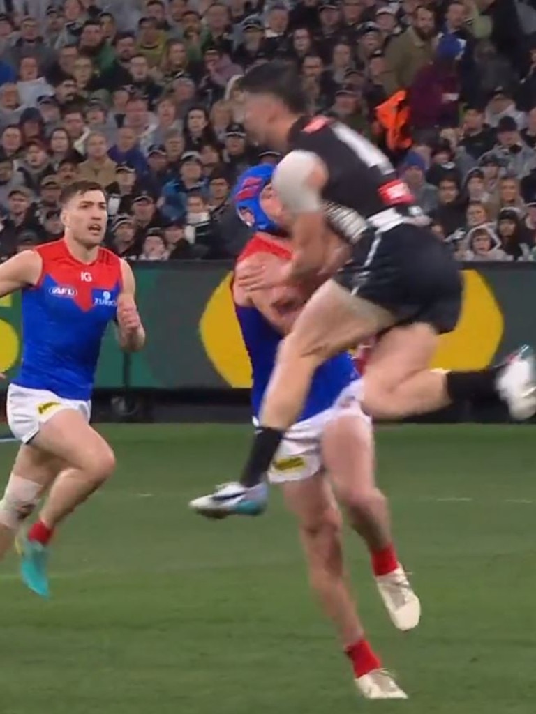 Angus Brayshaw of the Demons is cleaned up by Brayden Maynard. Pic: Fox Sports