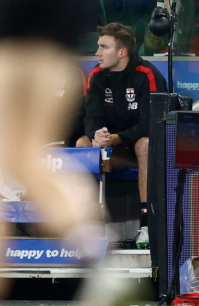 Dougal Howard of the Saints looks on from the bench after being subbed from the game with a hamstring injury on Saturday night. Picture: Michael Willson/AFL Photos via Getty Images.