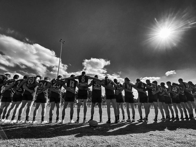 Hastings and Tyabb players line up for the national anthem and Last Post. Picture: Valeriu Campan