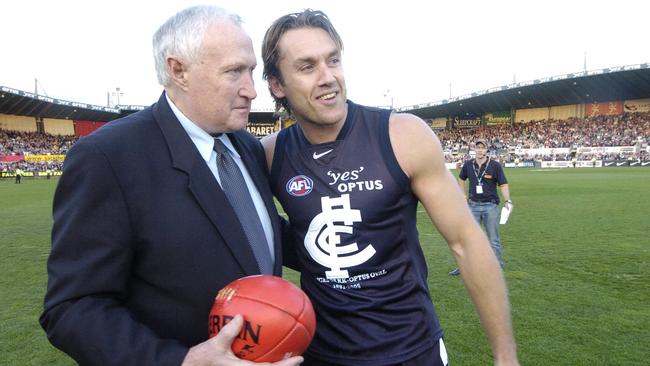 Anthony Koutoufides passes final match ball to John Nicholls. Last game at Princes Park. Carlton v Melbourne. Optus Oval.