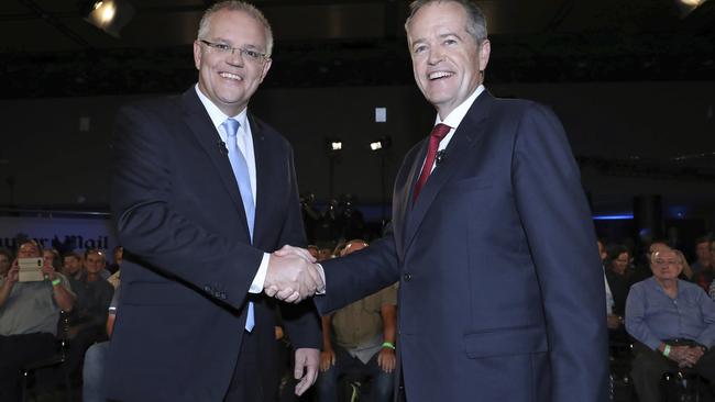 Australian Prime Minister Scott Morrison and opposition leader Bill Shorten’s election battle has led to a record amount of money flowing into betting agencies. (Gary Ramage/Pool via AP)