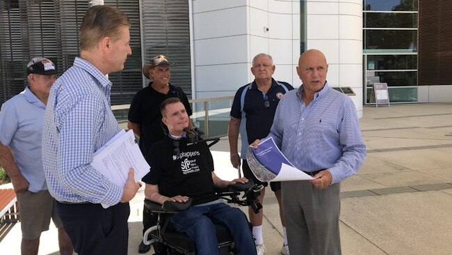 The team pushing for ocean pools on the Gold Coast presenting plans to a Gold Coast City Council representative.