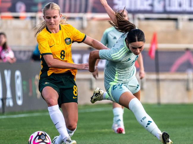 Australia's defender #20 Kaitlyn Torpey fouls Mexico's forward #20 Scarlett Camberos during the MexTour 2024 Women's International Friendly football match between Australia and Mexico at the Toyota Field Stadium in San Antonio, Texas, April 9, 2024. (Photo by SERGIO FLORES / AFP)