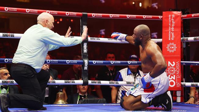 Referee Victor Loughlin stops the bout as Frank Sanchez is knocked down by Agit Kabayel. Photo by Richard Pelham/Getty Images)