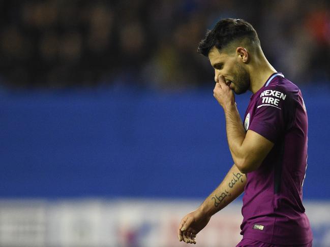 Manchester City's Argentinian striker Sergio Aguero reacts during the English FA Cup fifth round football match between Wigan Athletic and Manchester City at the DW Stadium in Wigan, northwest England, on February 19, 2018. / AFP PHOTO / Oli SCARFF / RESTRICTED TO EDITORIAL USE. No use with unauthorized audio, video, data, fixture lists, club/league logos or 'live' services. Online in-match use limited to 75 images, no video emulation. No use in betting, games or single club/league/player publications.  /