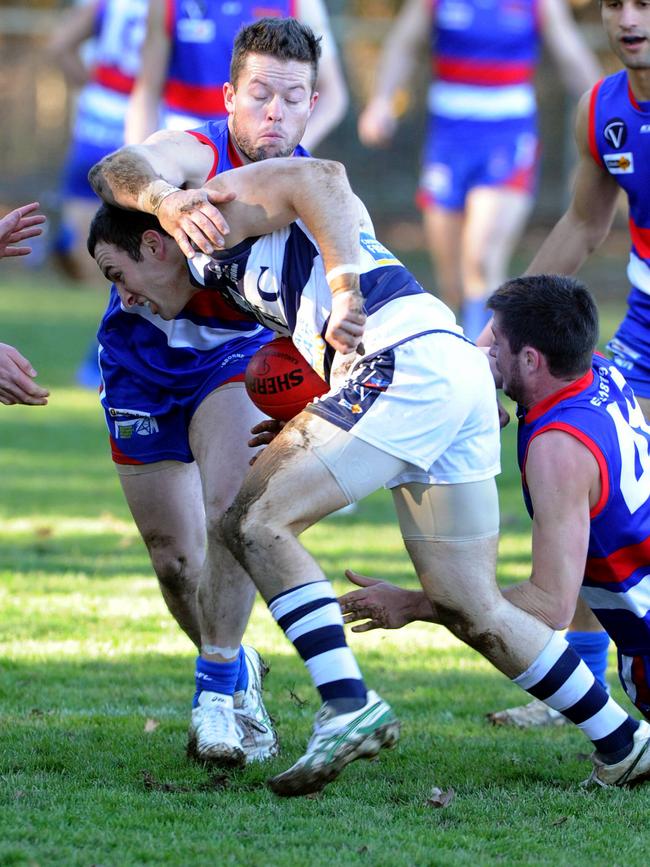 Scott Walsh lays a tackle for Gisborne against Strathfieldsaye.