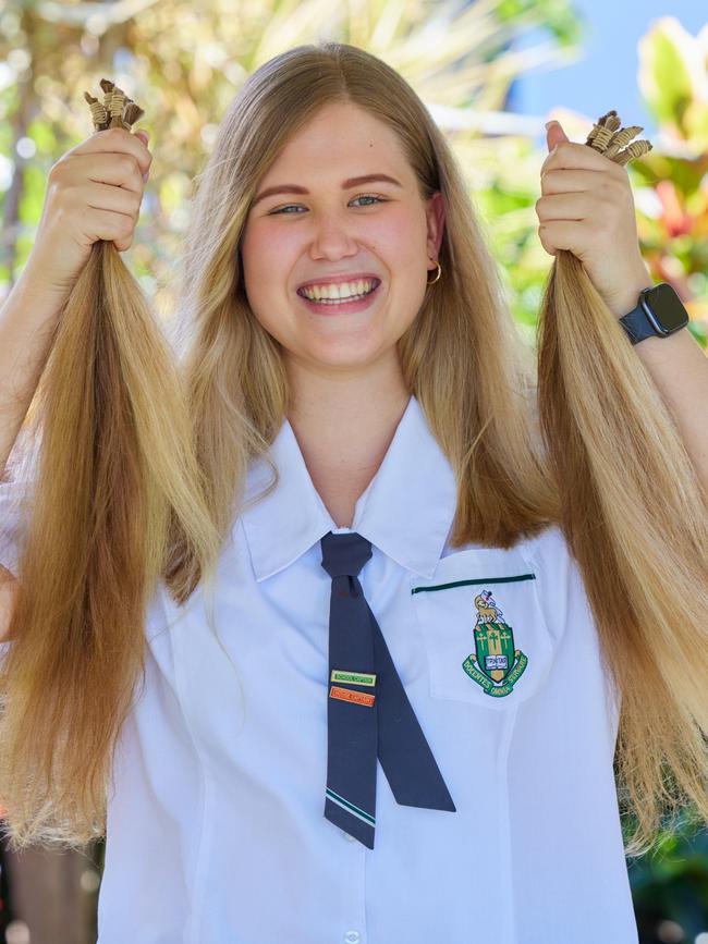 TAS school captain Aurelia Wood with her locks to be donated to the Ponytail Project. Picture: Romy Photography