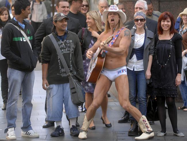 Iconic Times Square busker 'The Naked Cowboy', who plays his guitar in only his underwear, riding boots and hat 365 days a year, entertaining shoppers. Picture: Chris Pavlich