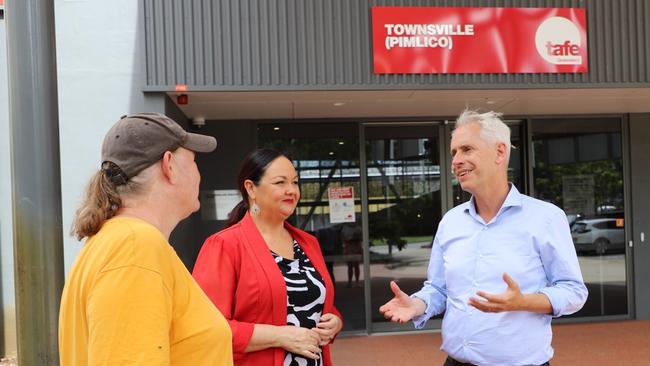 Susan Thompson, a Cert III in Visual Arts graduate, Labor candidate for Herbert Edwina Andrew with Minister for Skills and Training Andrew Giles outside TAFE Pimlico. Picture: Supplied