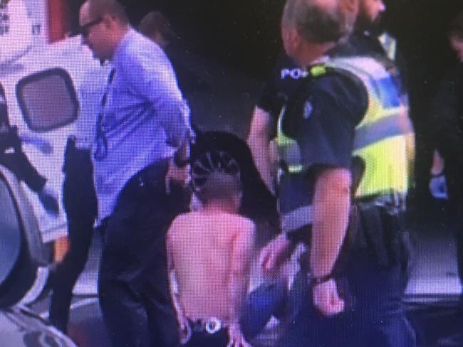 Police detain a man after a police chase in Northland