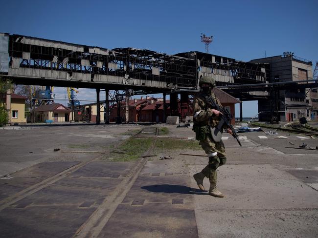 A Russian serviceman patrols in the port of Mariupol on April 29, 2022. Picture: Andrey Borodulin / AFP.