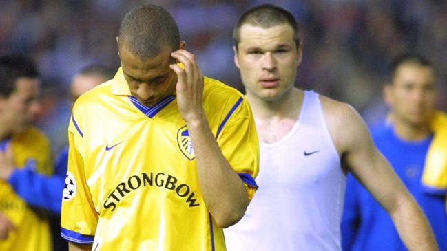 Rio Ferdinand (left) and Mark Viduka leave the pitch after Leeds’ loss to Valencia in the second leg of the Champions League semi-finals in 2001. Picture: AP