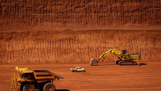 FILE PHOTO: Machinery operates in a pit at Rio Tinto Group's West Angelas iron ore mine in Pilbara, Australia, on Sunday, Feb. 19, 2012. Rio Tinto Group said Chief Executive Officer Tom Albanese will step down, after announcing a surprise $14 billion impairment. Sam Walsh, head of the iron-ore division, has been appointed as his successor with effect from today, the company said in a statement. Photographer: Ian Waldie/Bloomberg via Getty Images