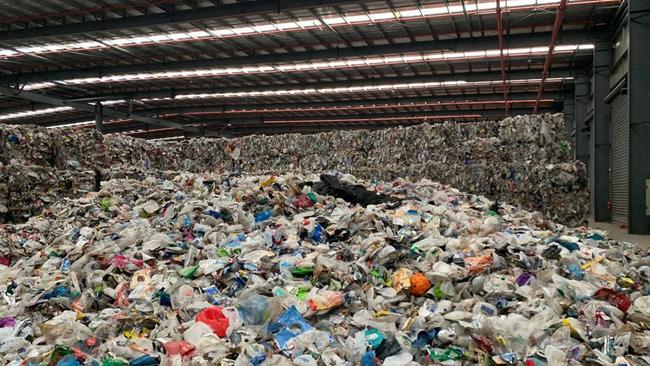 Recycling collected by SKM is piled in warehouses across Melbourne. Picture: Supplied