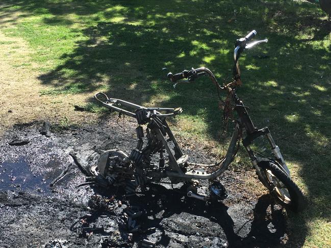 An electric hire bike which caught on fire and is incinerated moments after being hired out, and ridden along the Surfers Paradise esplanade on the Gold Coast. Firefighters put it out, warning electric bike batteries from China can be cheap and faulty.