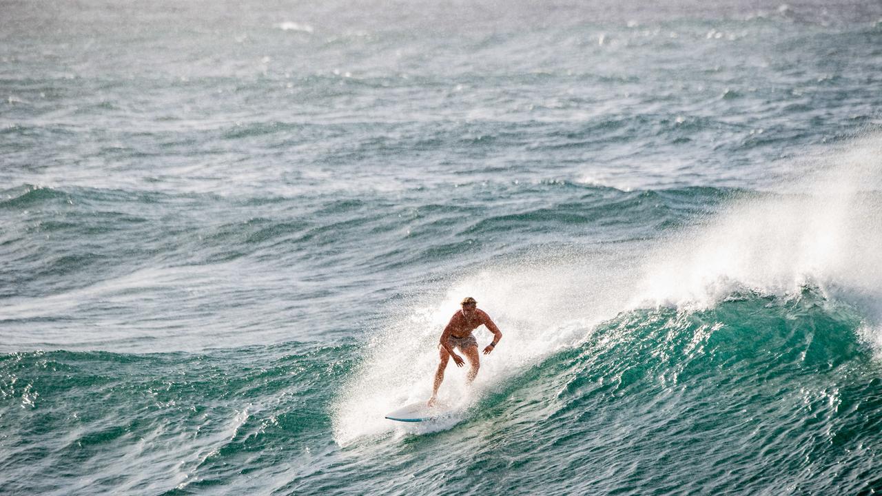 Surfers at Bondi Beach made the most of the massive swells and king tides battering parts of the NSW east coast. Picture: NewsWire / Monique Harmer