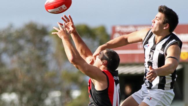 Riddell District Football Netball League round 4 match between Riddell and Wallan on May 9 2015. Riddell 18.18 (126) defeating Wallan 9.9 (63). The Magpies Danny Doolan manages to foil the Bombers Brian Ruffell from marking safely overhead. Picture: Aaron Cook