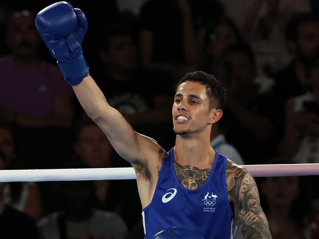 Australian boxer Charlie Senior in action against Abdumalik Khalokov in the men’s 57kg boxing at Roland-Garros. Picture: Adam Head