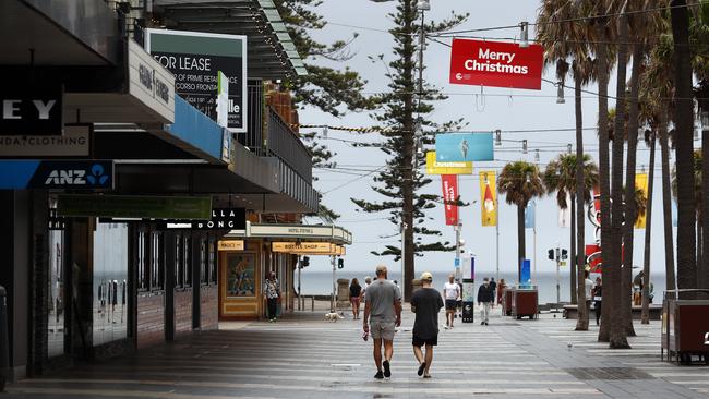 Manly Beach and Corso earlier today before a lockdown was implemented at 5pm. Residents can now only leave their homes for essential reasons. Picture: Sam Ruttyn