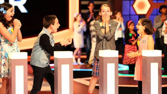 Their people ... Jye and Karl, middle, find kids just like them on the set of The Great Australian Spelling Bee.