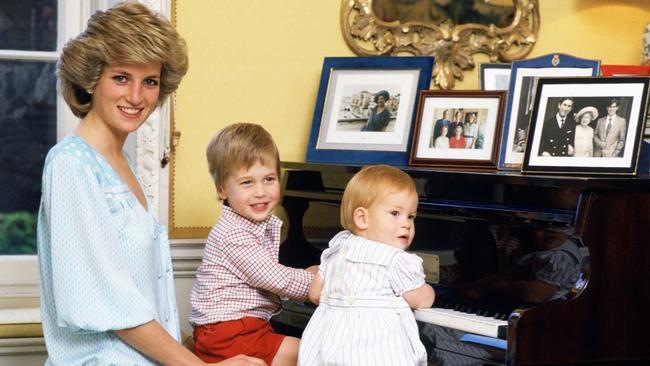 Diana, Princess of Wales with her sons, Prince William and Prince Harry, at the piano in Kensington Palace in 1985. Picture: Tim Graham Photo Library via Getty Images