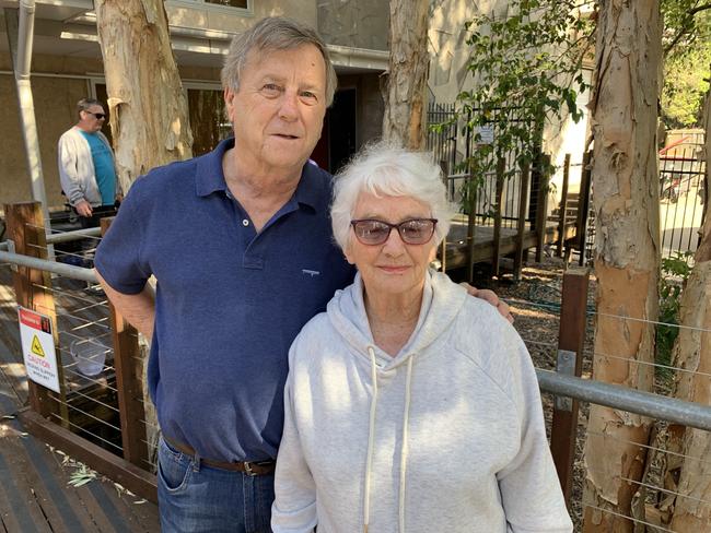 Peregian Beach resident Pam Murphy, who lost her home in the devastating fire, with neighbour Lester Harding.