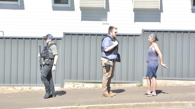 Police speak with members of the public at the scene of a fatal shooting in North Toowoomba on February 26, 2025.